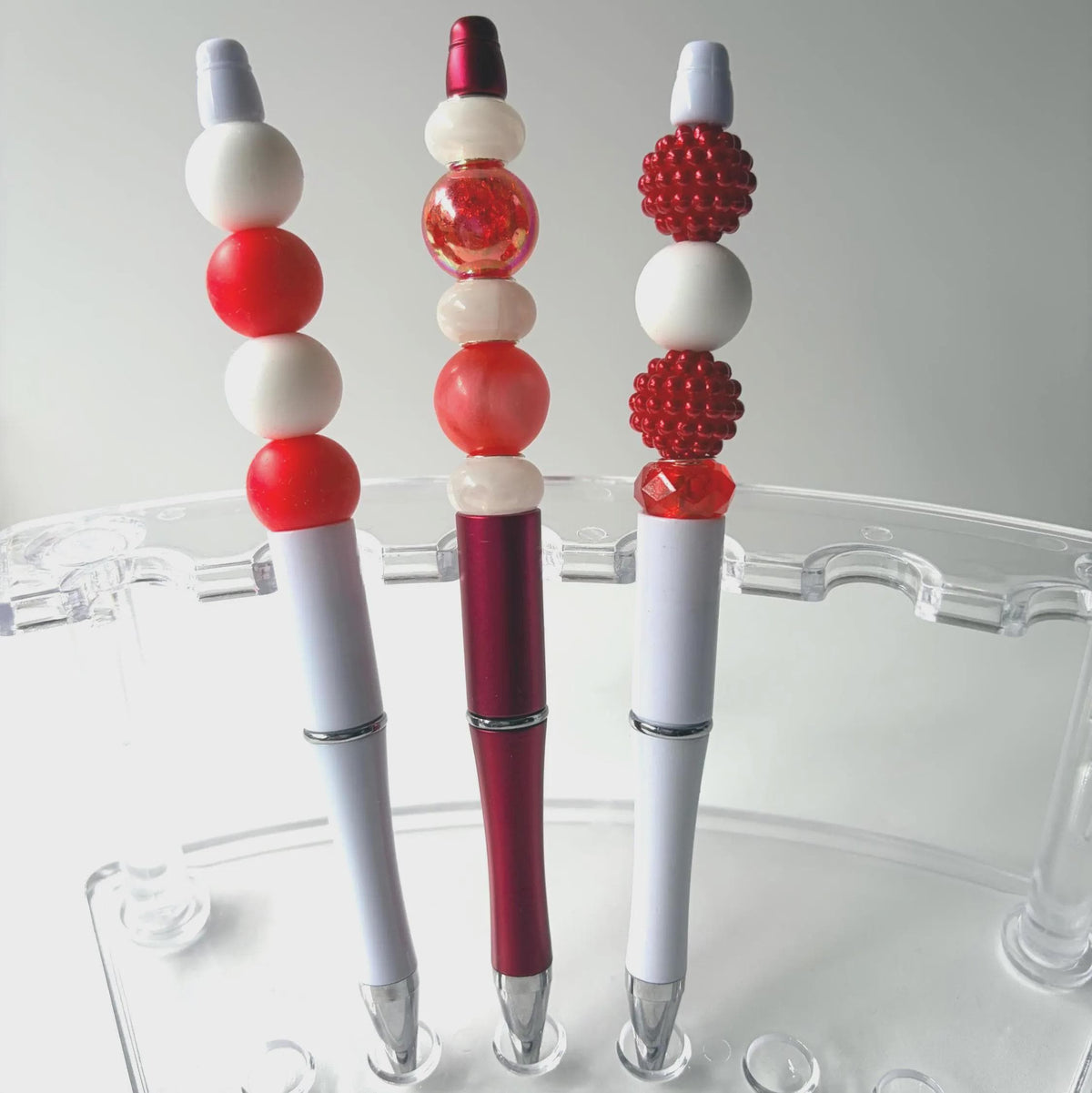 Folk Song, red and white beaded pen