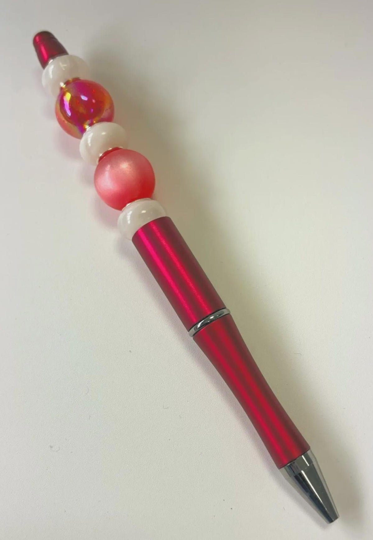 Folk Song, red and white beaded pen