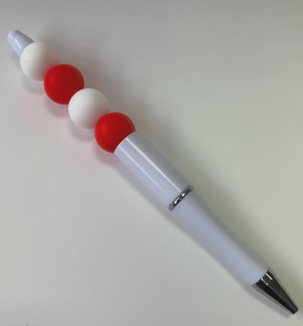 Folk Song, red and white beaded pen