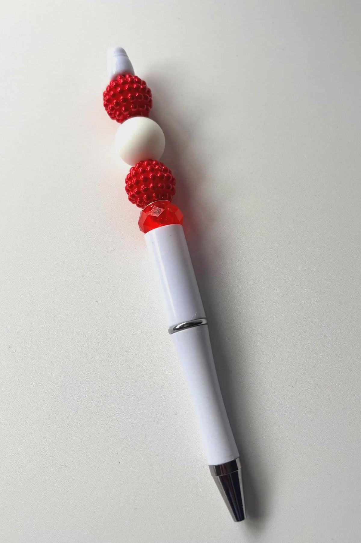 Folk Song, red and white beaded pen