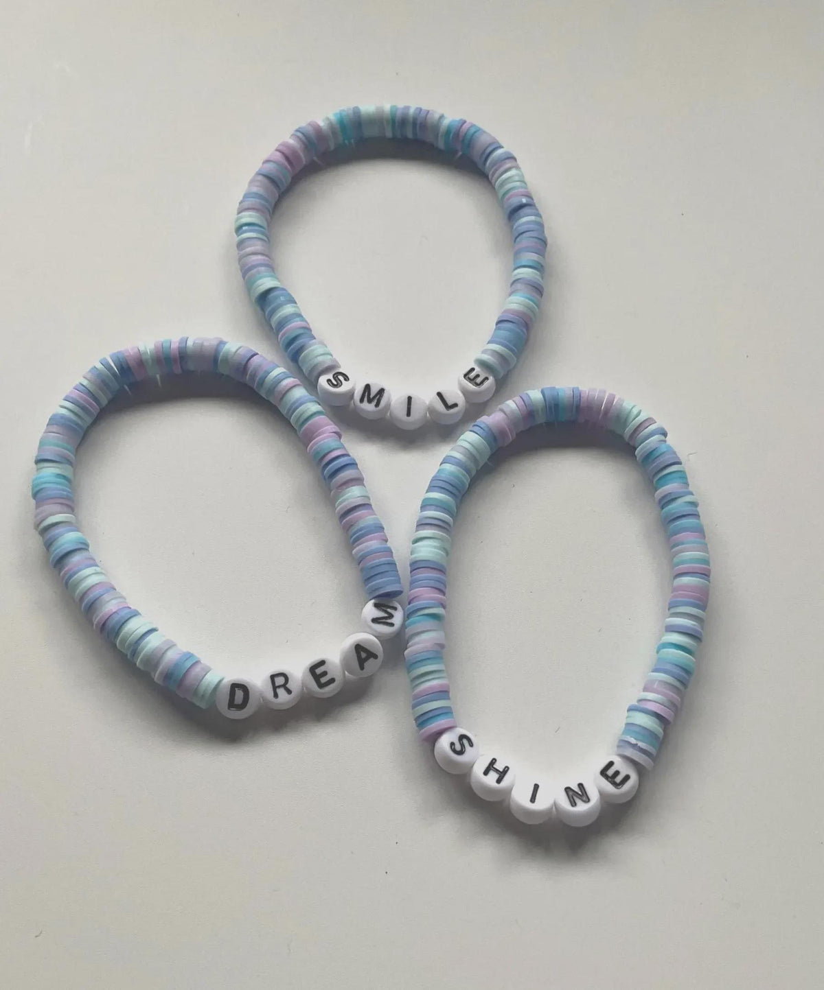 Smile Dream Shine Clay Bead bracelet stack, three bracelets, blue and purple beads